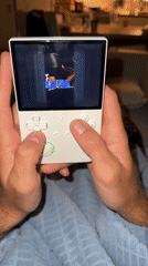 Person plays retro Sega handheld game in Fethiye, Turkey