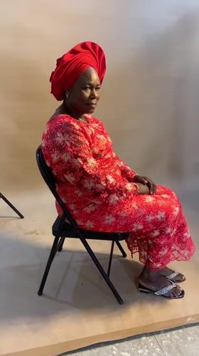Woman poses for portrait session at Nigerian photo studio