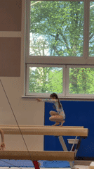 Young gymnasts practice routines at Riga training facility