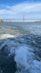 Boat journey on Tagus River captures 25 de Abril Bridge views