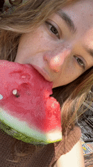Woman enjoys watermelon outdoors in Puebla