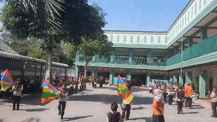 School courtyard drill and flag performance in Jatitengah, Indonesia