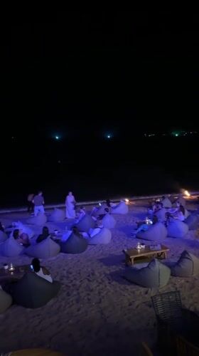 Evening beach lounge gathering in Baan Bo Phut, Thailand