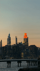 Empire State Building glows red at sunset in NYC