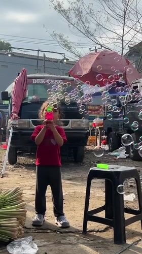 Daily life unfolds at Ubud markets as vendors, tourists mingle