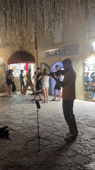 Budva old town: street violin, coastal scenes, summer evening
