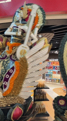 Bali airport duty-free zone packed with ornate Balinese cultural displays