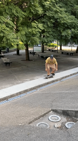 Skateboarder performs aerial trick in Buenos Aires park