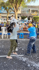 Street foam fight captured in Tacna, Peru