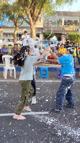 Street foam fight captured in Tacna, Peru