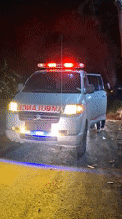 Emergency ambulance responds at night in rural Indonesian village