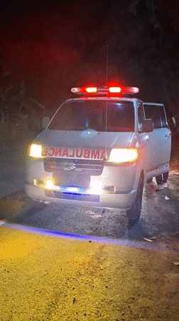 Emergency ambulance responds at night in rural Indonesian village