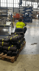 Lufthansa Technik worker sits on pallet in Varna warehouse