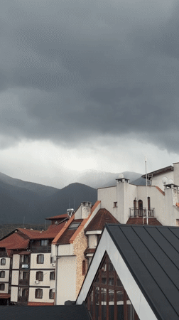Cloudy conditions blanket mountains in Bansko, Bulgaria