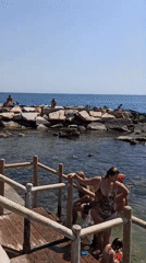 Trani's beaches in full summer swing on a clear June morning