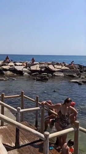 Trani's beaches in full summer swing on a clear June morning