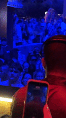DJ performs for crowd at foliage-decorated club in Kuta Selatan