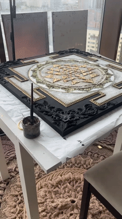 Artist works on geometric painting in Novosibirsk studio