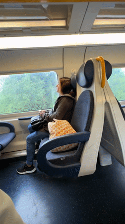Milan train carries passengers during morning commute