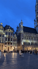 Evening pedestrian activity captured in historic Brussels square