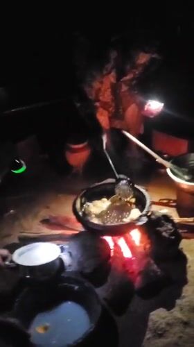 Man cooks over open fire in Winters, Texas