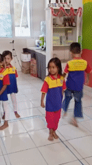 Kids in uniform and face paint at a Ciseeng school event