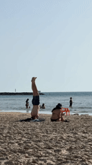 Beachgoers enjoy leisure activities on Tel Aviv shore