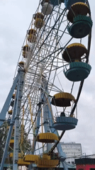 Ferris wheel spinning under overcast skies in Novosibirsk