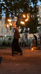 Fire performers entertain crowds at dusk in Saint Petersburg