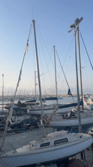 Torrevieja boatyard: hauled-out vessels and storm-damaged rigging