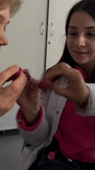 Moscow lab researchers examine speckled red eggs with mixed reactions