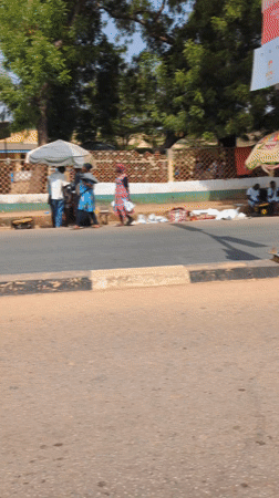 Street vendors gather roadside in Kaduna, Nigeria