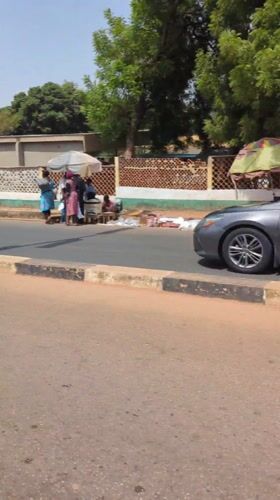 Street vendors gather roadside in Kaduna, Nigeria