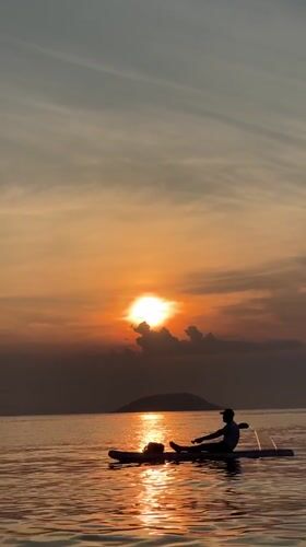Paddleboarding at golden hour on Nha Trang bay