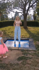 Afternoon park play around a trampoline in Sokolov, Czechia