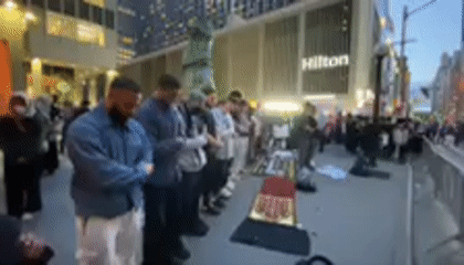 Muslim men perform street prayer in New York