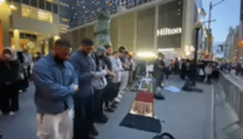 Muslim men perform street prayer in New York
