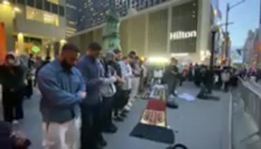 Muslim men perform street prayer in New York