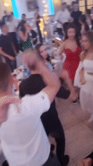 Young adults dance at celebration in Parvomai, Bulgaria