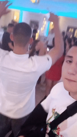 Young adults dance at celebration in Parvomai, Bulgaria