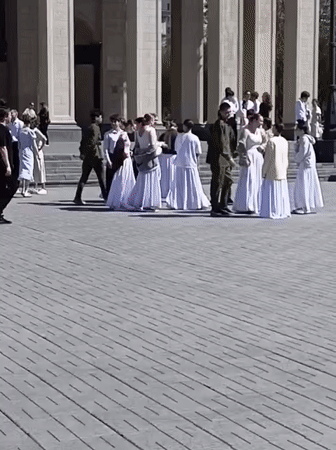 Students rehearse in formal attire at Novosibirsk plaza