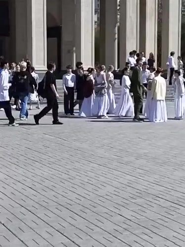 Students rehearse in formal attire at Novosibirsk plaza