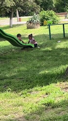 Children play on slide at Lozarevo playground