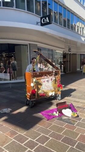 Street organ busker performs in Winterthur pedestrian area