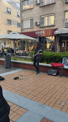 Street musician performs near Alexander Nevsky Cathedral in Sofia