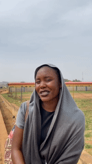 Woman photographed in traditional dress across Nigerian villages
