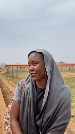 Woman photographed in traditional dress across Nigerian villages