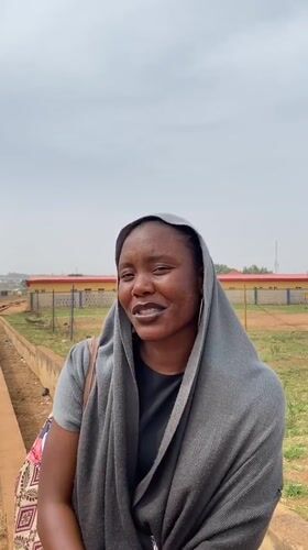 Woman photographed in traditional dress across Nigerian villages