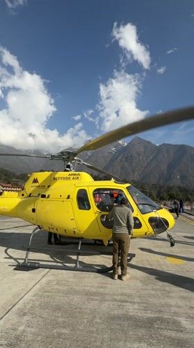 Helicopter operations observed at Lukla helipad amid clear mountain weather