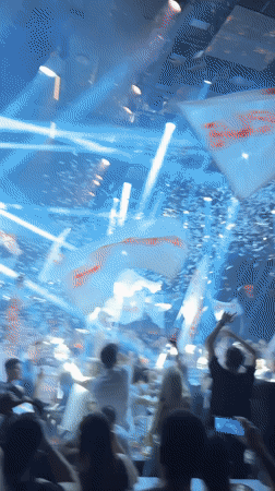 Nightclub celebration with flag-waving crowd captured in Plovdiv